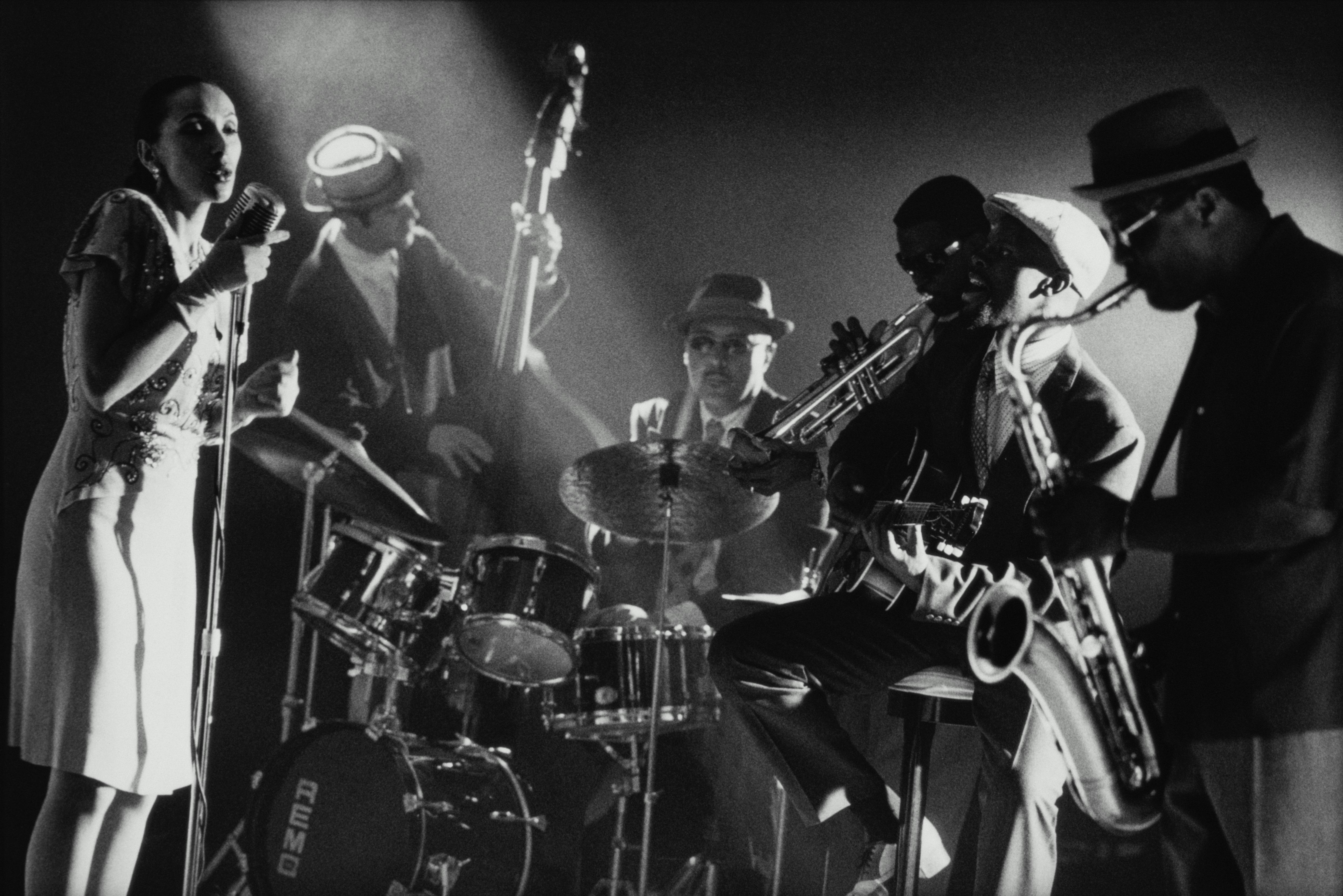 Jazz singer performing in club (B&W)