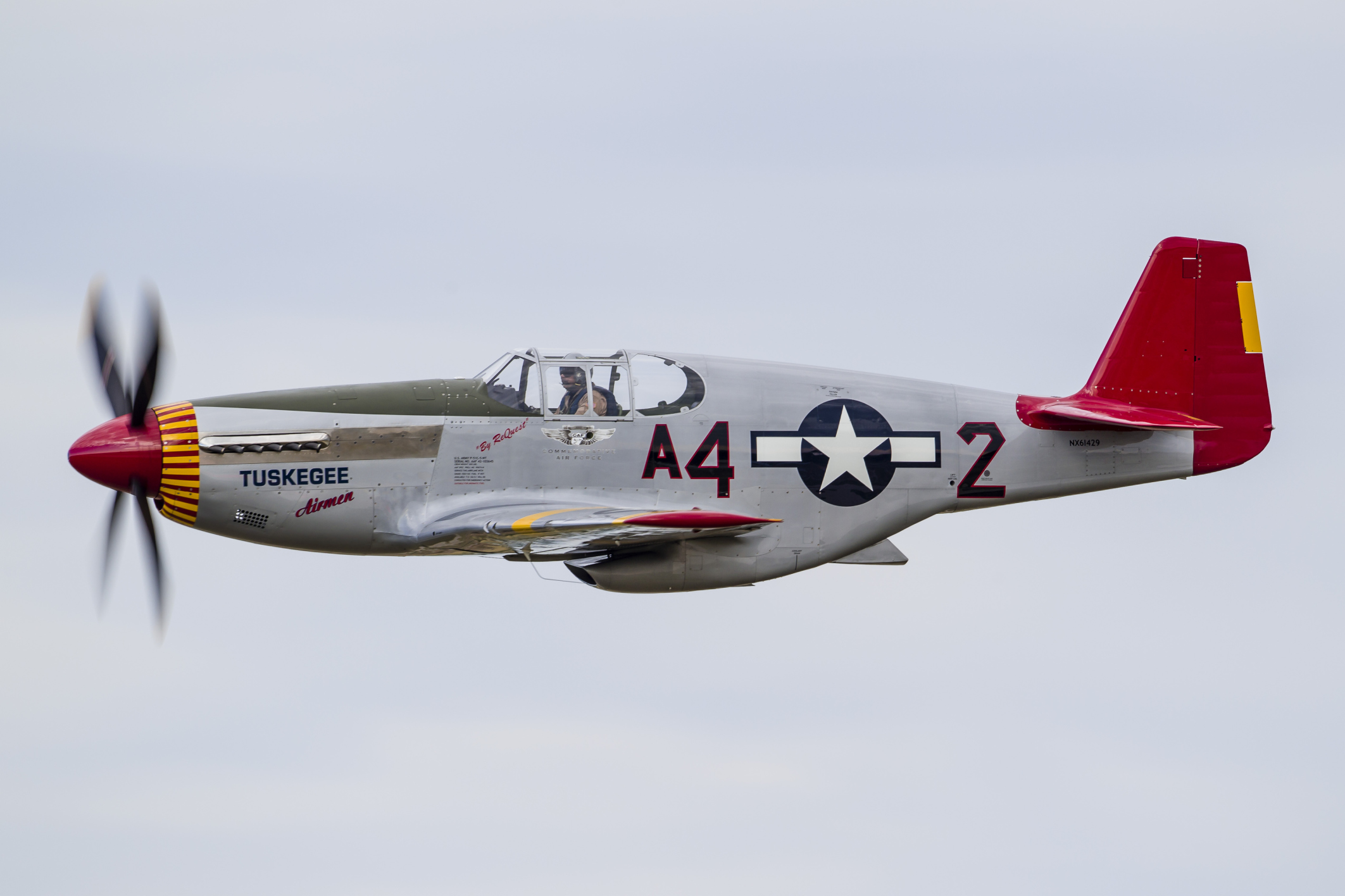 A P-51 Mustang flies by at EAA Airventure, Oshkosh, Wisconsin.